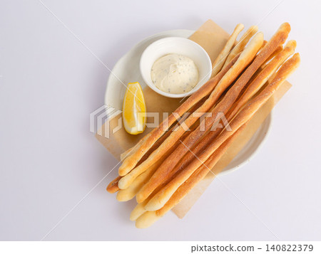 Plate of homemade grissini and cream cheese dip 03 Plate of homemade grissini and cream cheese dip 03 140822379