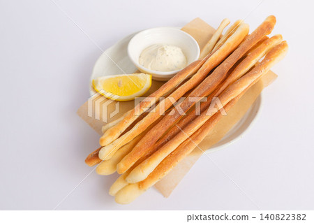 Plate 05 of homemade grissini and cream cheese dip Plate 05 of homemade grissini and cream cheese dip 140822382