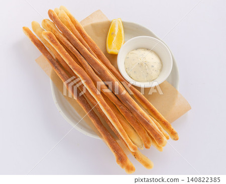 Plate of homemade grissini and cream cheese dip 07 Plate of homemade grissini and cream cheese dip 07 140822385