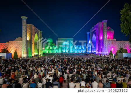 Uzbekistan, Samarkand, Registan Square: A colorful nighttime light show. 140823112