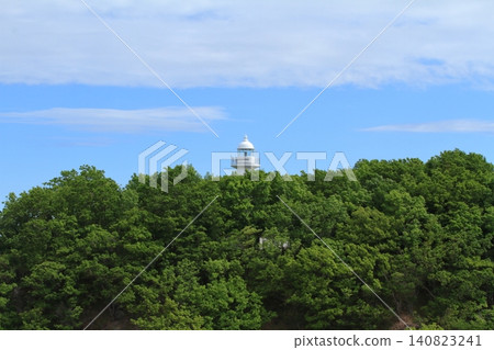 The view of Utoro Lighthouse against the backdrop of the lush green forests of Shiretoko. The view of Utoro Lighthouse against the backdrop of the lush green forests of Shiretoko. 140823241