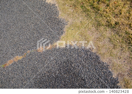 Asphalt and grass 140823428