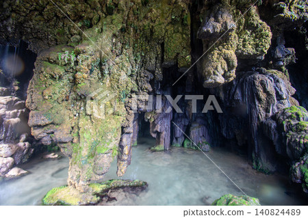 Clear water pool inside Goa Tetes limestone cave at Tumpak Sewu canyon Indonesia Clear water pool inside Goa Tetes limestone cave at Tumpak Sewu canyon Indonesia 140824489