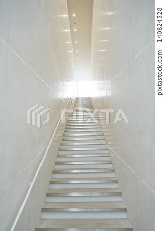 A large, empty space and staircase A large, empty space and staircase 140824528