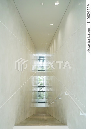 A large, empty space and staircase A large, empty space and staircase 140824529