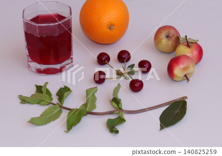 glass of juice and fresh ripe oranges 140825259