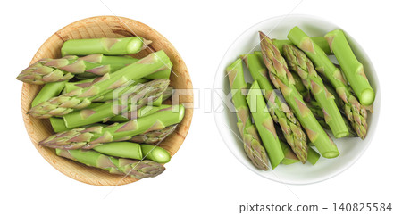 fresh asparagus in wooden bowl isolated on white background. Top view. Flat lay. fresh asparagus in wooden bowl isolated on white background. Top view. Flat lay. 140825584