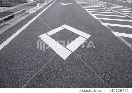 Diamond markings and road markings before a pedestrian crossing | Traffic safety and warning image 140826761