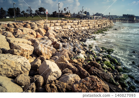 Waves crashing against the rocky coastline with a view of the Mediterranean Sea in Tel Aviv Waves crashing against the rocky coastline with a view of the Mediterranean Sea in Tel Aviv 140827093