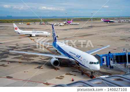 View from the "Sky Deck" at Chubu Centrair International Airport: Domestic passenger planes parked on the apron. 140827108