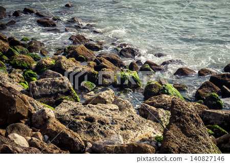 Waves crashing against the rocky coastline with a view of the Mediterranean Sea in Tel Aviv Waves crashing against the rocky coastline with a view of the Mediterranean Sea in Tel Aviv 140827146
