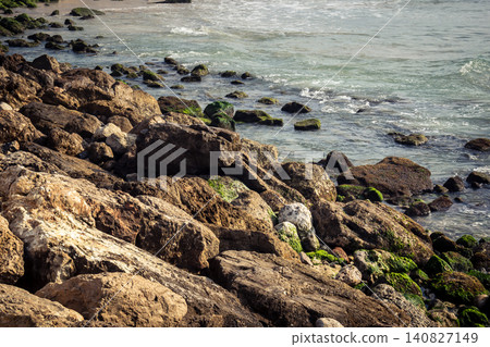 Waves crashing against the rocky coastline with a view of the Mediterranean Sea in Tel Aviv Waves crashing against the rocky coastline with a view of the Mediterranean Sea in Tel Aviv 140827149