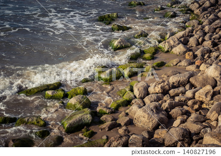 Waves crashing against the rocky coastline with a view of the Mediterranean Sea in Tel Aviv Waves crashing against the rocky coastline with a view of the Mediterranean Sea in Tel Aviv 140827196