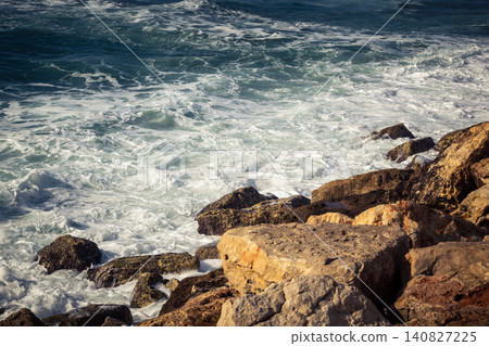 Waves crashing against the rocky coastline with a view of the Mediterranean Sea in Tel Aviv Waves crashing against the rocky coastline with a view of the Mediterranean Sea in Tel Aviv 140827225