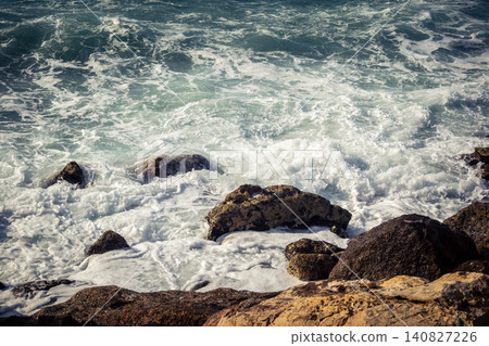 Waves crashing against the rocky coastline with a view of the Mediterranean Sea in Tel Aviv Waves crashing against the rocky coastline with a view of the Mediterranean Sea in Tel Aviv 140827226