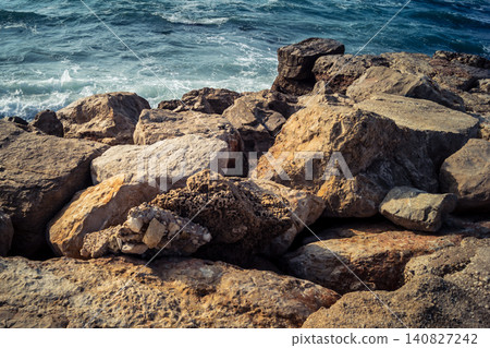 Waves crashing against the rocky coastline with a view of the Mediterranean Sea in Tel Aviv Waves crashing against the rocky coastline with a view of the Mediterranean Sea in Tel Aviv 140827242