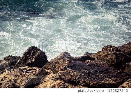 Waves crashing against the rocky coastline with a view of the Mediterranean Sea in Tel Aviv Waves crashing against the rocky coastline with a view of the Mediterranean Sea in Tel Aviv 140827243