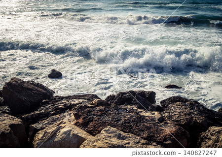 Waves crashing against the rocky coastline with a view of the Mediterranean Sea in Tel Aviv Waves crashing against the rocky coastline with a view of the Mediterranean Sea in Tel Aviv 140827247