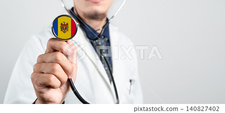 Moldova healthcare system, Moldovan national healthcare concept. Hand of doctor holding stethoscope Moldova healthcare system, Moldovan national healthcare concept. Hand of doctor holding stethoscope 140827402