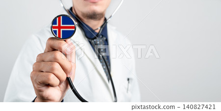 Iceland healthcare system, Icelandic national healthcare concept. Hand of doctor holding stethoscope Iceland healthcare system, Icelandic national healthcare concept. Hand of doctor holding stethoscope 140827421