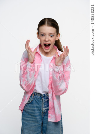 Shocked teenage girl with surprised facial expression Shocked teenage girl with surprised facial expression 140828221