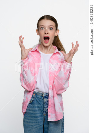 Shocked teenage girl with surprised facial expression Shocked teenage girl with surprised facial expression 140828222