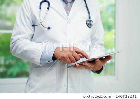 Doctor checking and note diagnosis medicine in clipboard of patients in hospital. Doctor checking and note diagnosis medicine in clipboard of patients in hospital. 140828231