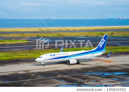 View from the "Sky Deck" at Chubu Centrair International Airport: Domestic passenger planes heading to the runway for takeoff. 140828502