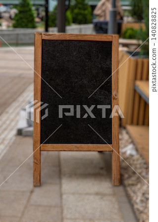Modern urban outdoor cafe terrace with chalkboard sign Modern urban outdoor cafe terrace with chalkboard sign 140828825