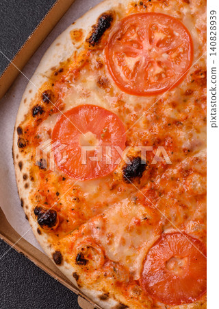 Italian pizza margherita with cheese, tomatoes, and tomato sauce, fast food. Pizza margherita 140828939