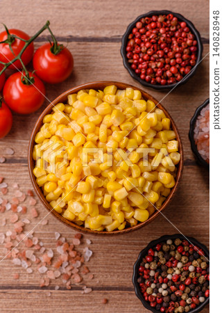 Golden, sweet canned corn kernels or maize for salads and vegetarian dishes. Canned corn 140828948