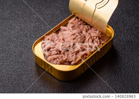 Fish, canned tuna chunks in brine for sandwiches and salads. Canned tuna Fish, canned tuna chunks in brine for sandwiches and salads. Canned tuna 140828963