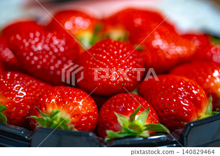 Fresh organic strawberries background, Fresh ripe organic strawberry in a dark plate Fresh organic strawberries background, Fresh ripe organic strawberry in a dark plate 140829464