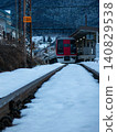 Nagano Electric Railway Snow Monkey train and Yudanaka Station platform 140829538
