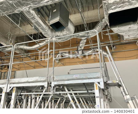 Ceiling equipment construction site Equipment construction site with temporary materials in place Ceiling equipment construction site Equipment construction site with temporary materials in place 140830401