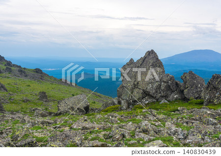 Mountain landscape with green grass and rocks. North Urals. 140830439