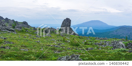 Mountain landscape with green grass and rocks. Urals. Mountain landscape with green grass and rocks. Urals. 140830442