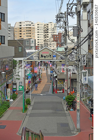 A view of the sunset steps, a retro panoramic view of Yanaka Ginza Shopping Street, a symbol of Yanaka, Nezu, and Sendagi (Yanaka-Nezu-Sendagi). A view of the sunset steps, a retro panoramic view of Yanaka Ginza Shopping Street, a symbol of Yanaka, Nezu, and Sendagi (Yanaka-Nezu-Sendagi). 140830687