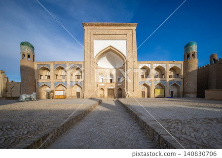 The historic Kutlugh Murad Inak Madrasa in Khiva-Ichan Kala, a UNESCO World Heritage Site in Uzbekistan. The historic Kutlugh Murad Inak Madrasa in Khiva-Ichan Kala, a UNESCO World Heritage Site in Uzbekistan. 140830706