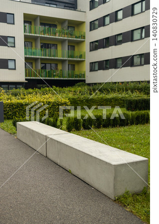 Modern concrete benches and landscaping in residential building courtyard Modern concrete benches and landscaping in residential building courtyard 140830729