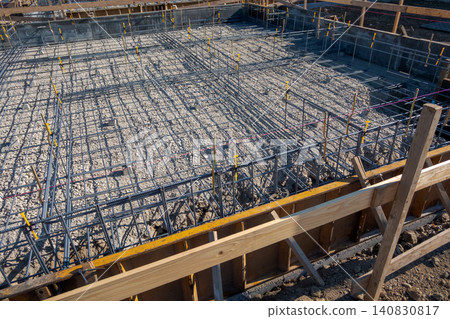 Reinforcement arrangement of the building foundation with assembled steel bars. Reinforcement arrangement of the building foundation with assembled steel bars. 140830817