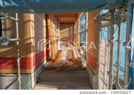 Interior passageway and insulation during the construction of a wooden house Interior passageway and insulation during the construction of a wooden house 140830827