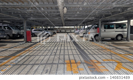 Cars lined up in a covered parking lot in Japan Cars lined up in a covered parking lot in Japan 140831489