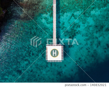 Aerial view of helipad over the sea 140832021