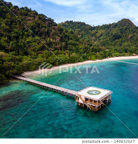 Aerial view of tropical beach landscape with floating jetty and helipad in front of resort in Burma Aerial view of tropical beach landscape with floating jetty and helipad in front of resort in Burma 140832027
