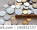 Old golden and silber coins in the wood box. Money from France, Poland, Italy, England, Denmark. Various coins for business. Financial concept. 140832157