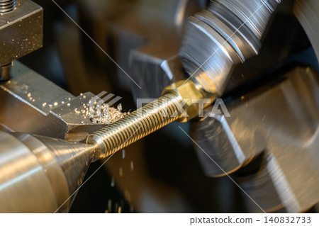 High-precision lathe machine performing an outside thread making process on brass material shaft parts. High-precision lathe machine performing an outside thread making process on brass material shaft parts. 140832733