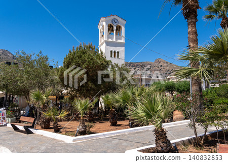White clock tower and belfry of the Orthodox Church of Saints Constantine and Helena in Elounda, Crete, Greece White clock tower and belfry of the Orthodox Church of Saints Constantine and Helena in Elounda, Crete, Greece 140832853