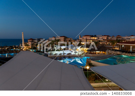 Luxury sea resort with illuminated swimming pools at twilight Luxury sea resort with illuminated swimming pools at twilight 140833008