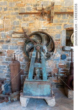 Vintage mechanical pump machine in old olive oil factory museum 140833056